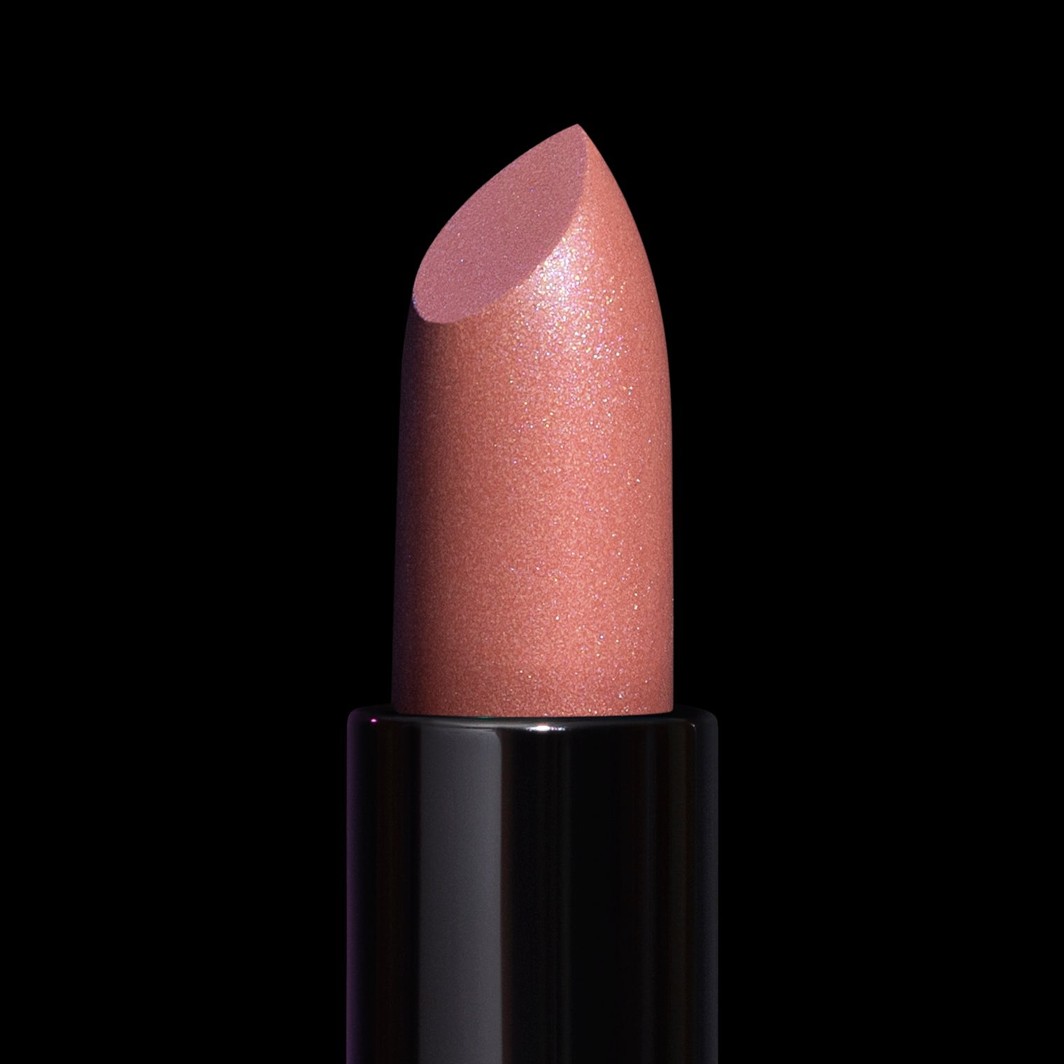 Sea Goddess lipstick bullet close-up: shimmering peachy nude with a pearly opalescent finish