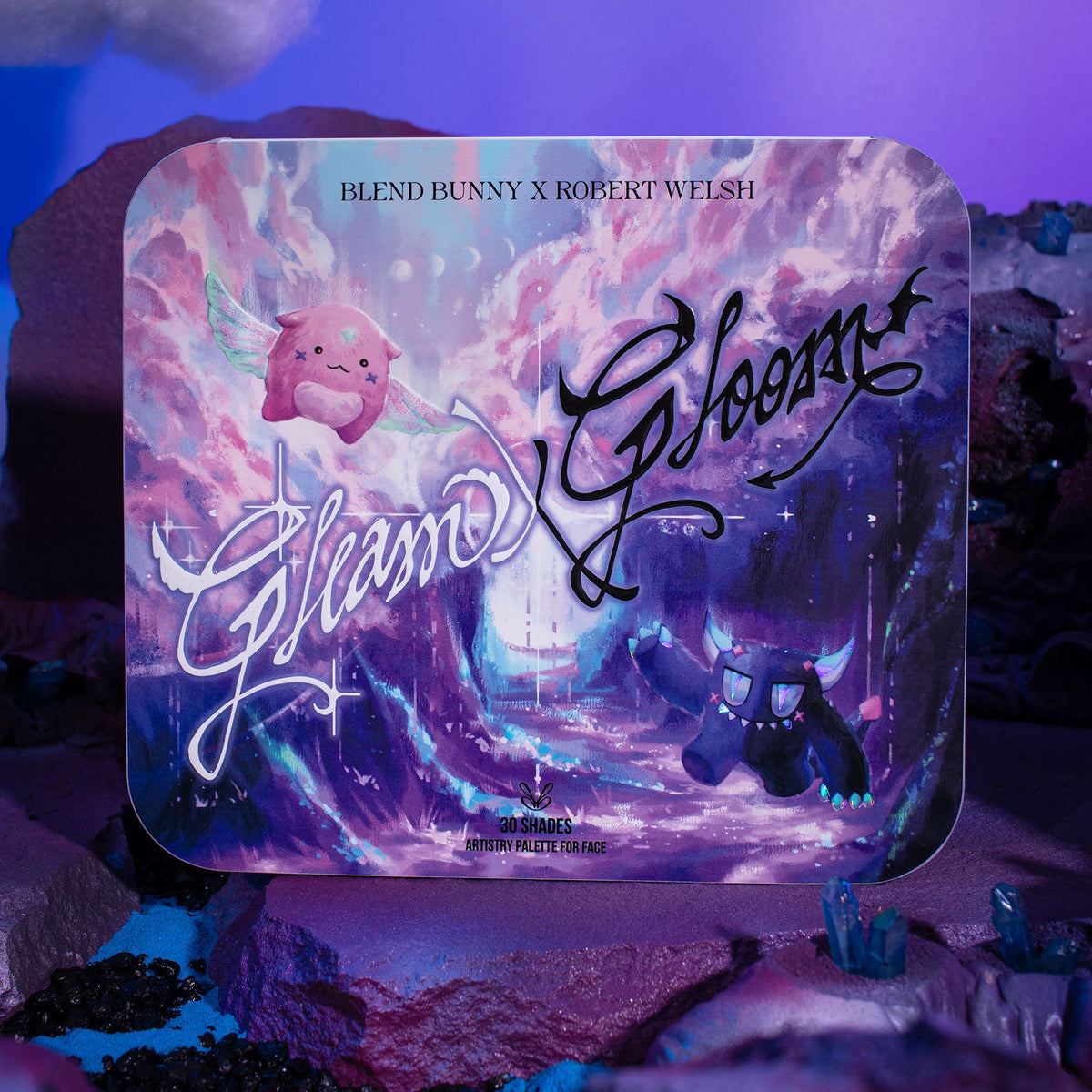 Closed Gleam x Gloom palette standing on a purple styled set, lid artwork facing the camera.
