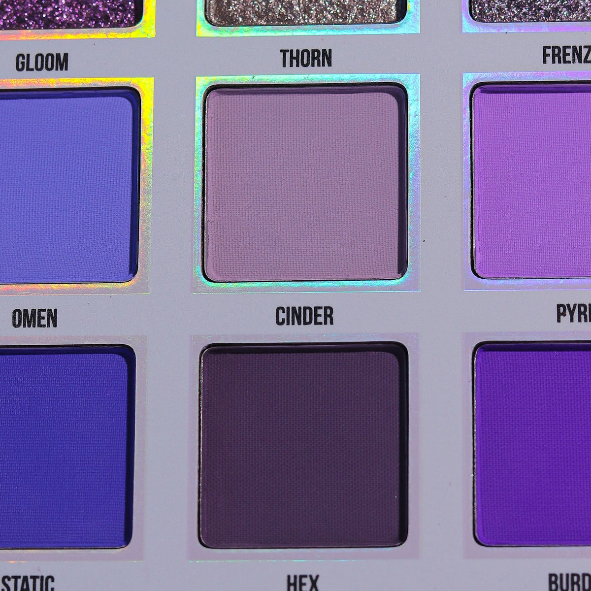 Close-up of the Gleam x Gloom pans showing the shade names Gloom, Thorn, Omen, Cinder and Hex.