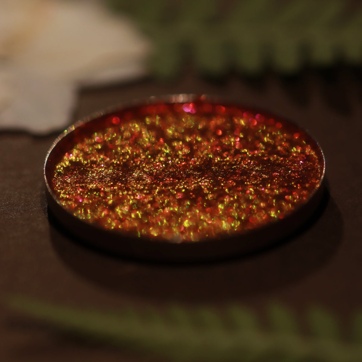 Coven Concoction pan close-up: red with orange and gold shift.