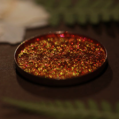 Coven Concoction pan close-up: red with orange and gold shift.