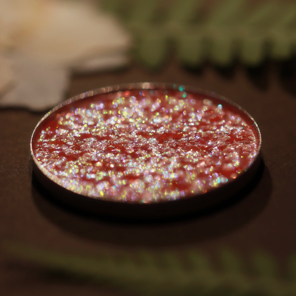 Grimoire Garden pan close-up: pale peach with multicoloured sparkle.
