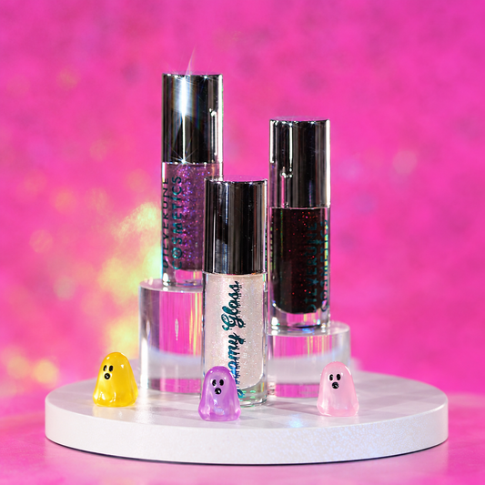 Dieverune Sporkleween Gloomy gloss in Purple Potion, Moonlit Magic and Seance Shimmer on clear risers beside small ghost figures