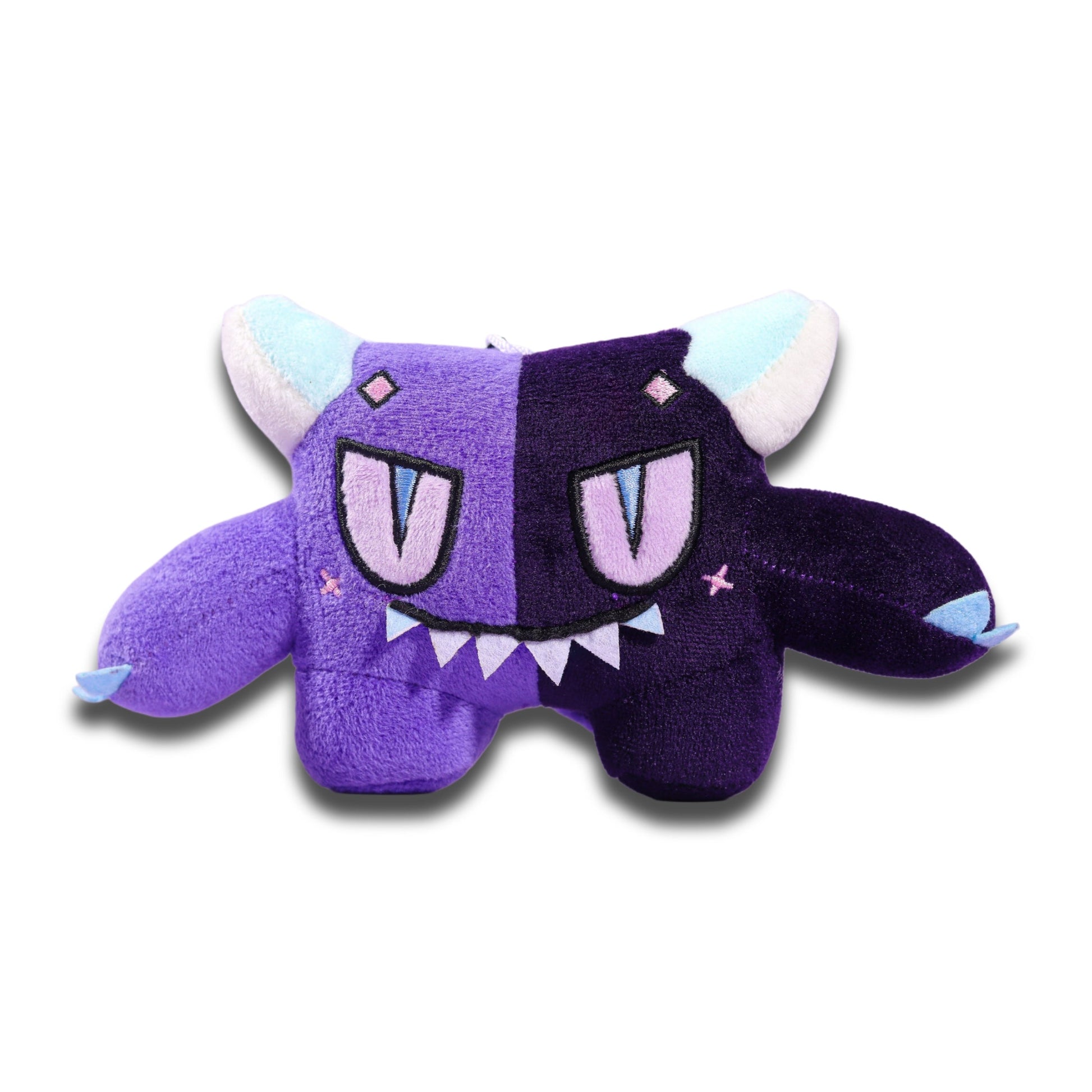 Gloom plush keychain from the front, a two-tone purple critter with pale blue horns, a fanged grin and short wings.