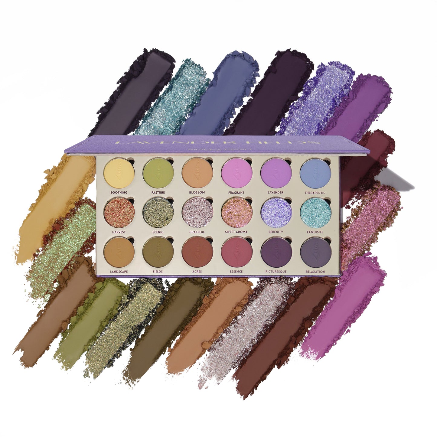 Lavender Fields palette open, showing 18 pans in three rows of lilacs, greens, yellows, and neutrals with six shimmer pans, over matching swatch smears