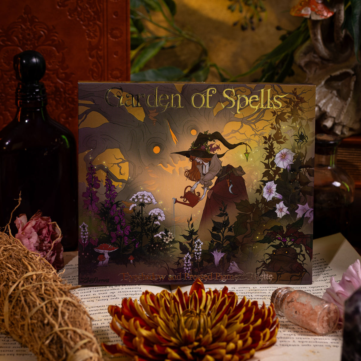 Garden of Spells palette cover art: a witch watering a flower garden beneath a gnarled tree with glowing eyes.