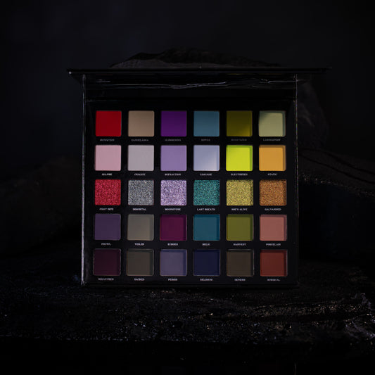 The 30 Ellis V3 pans in five rows of six, lit low on a dark rock set, the row of six shimmers across the middle.