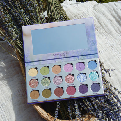 Lavender Fields palette open on a bundle of dried lavender in a basket, mirror lid reflecting the sky