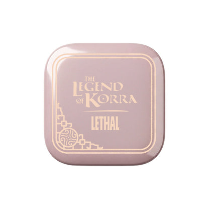 Closed dusty pink compact with a gold foil Legend of Korra and LETHAL lid design and an ornate corner emblem
