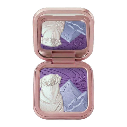Compact fully open and flat, pan and lid mirror both in frame, showing the white, icy blue and purple embossed scene