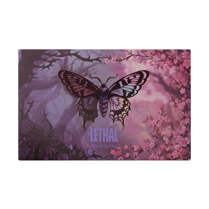 Black Spring palette closed packaging by Lethal, butterfly illustration over a misty purple forest with cherry blossoms and dark thorned branches