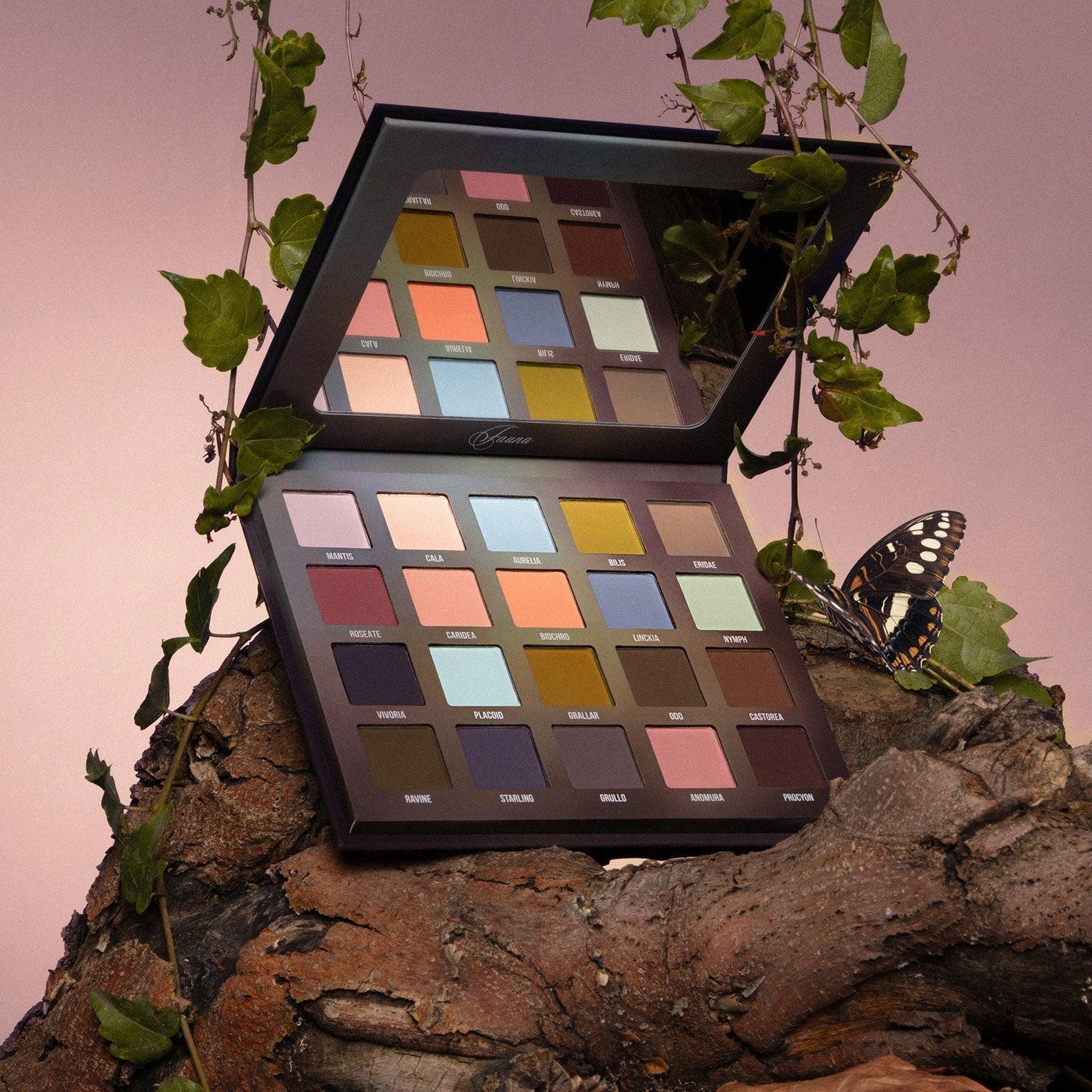 Fauna palette open and propped on bark with trailing ivy and a butterfly