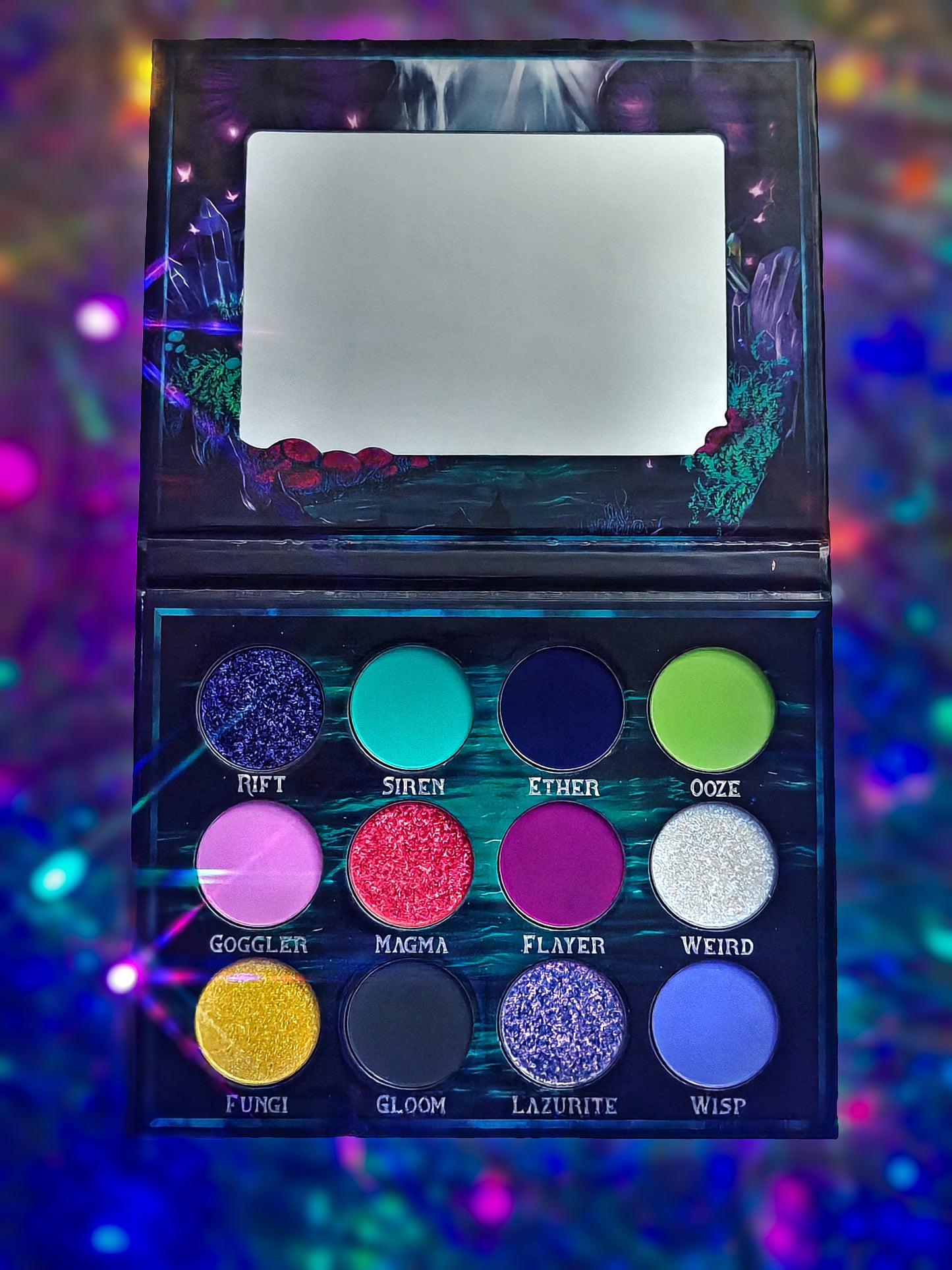 Cosmic Cove palette open on a holographic backdrop, vertical view with the mirror at top and twelve pans arranged in three rows below