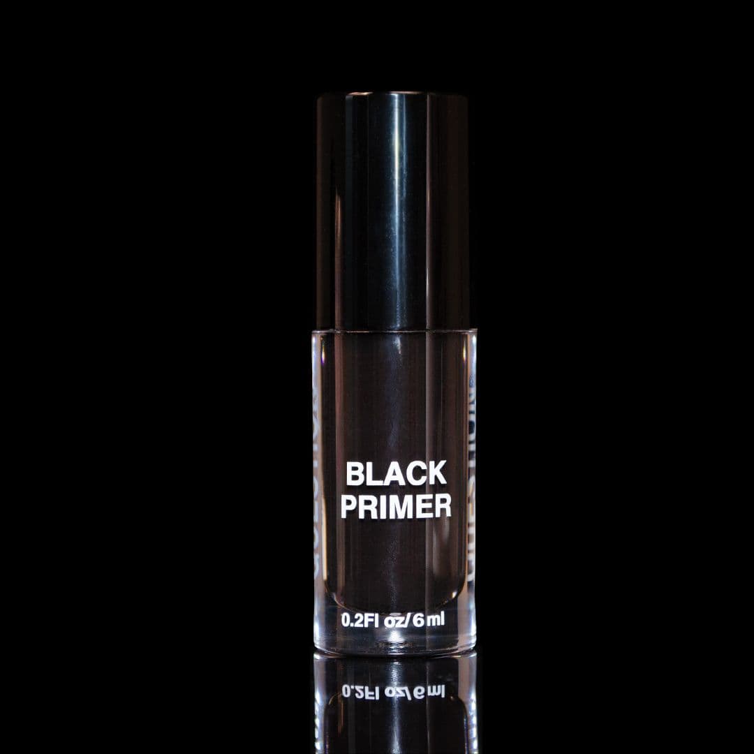 Question Beauty Black Primer 6ml clear glass bottle with glossy black cap and white label, on a black reflective surface.