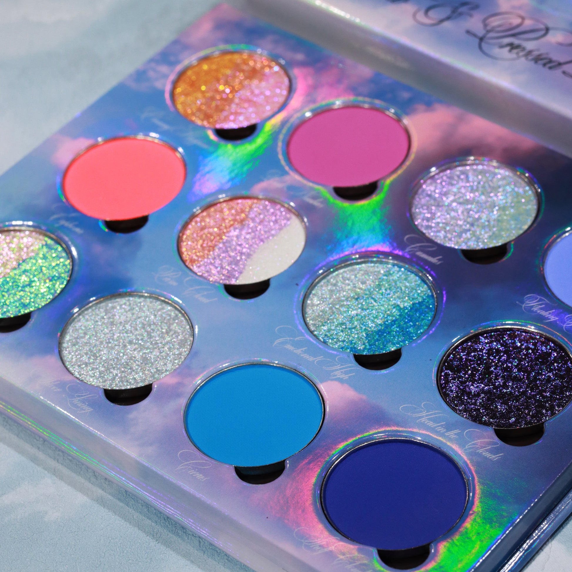 On Cloud 9 pans close-up, coral and magenta mattes with teal and silver multi-chrome shimmers