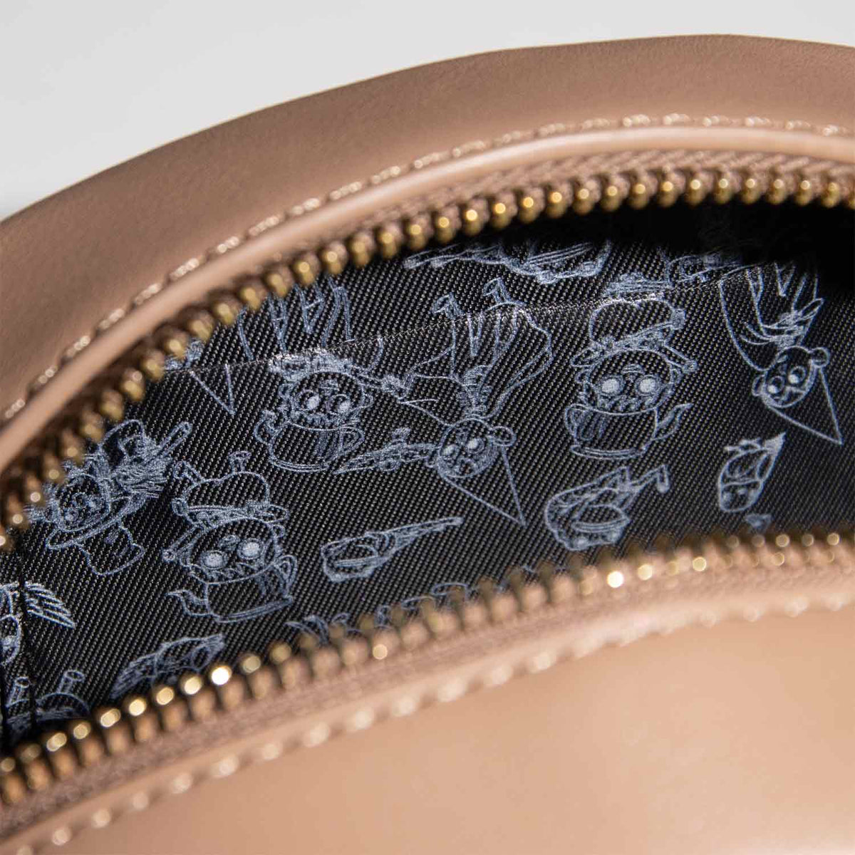 Open zipper showing black satin lining with white line drawings of Wirt, Greg and Beatrice