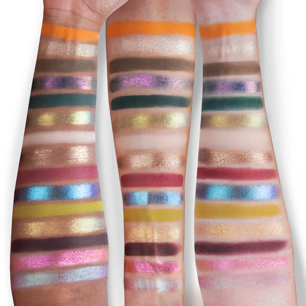 Palette swatched on three skin tones: orange, browns, greens, purples, pinks, blues and gold in horizontal stripes