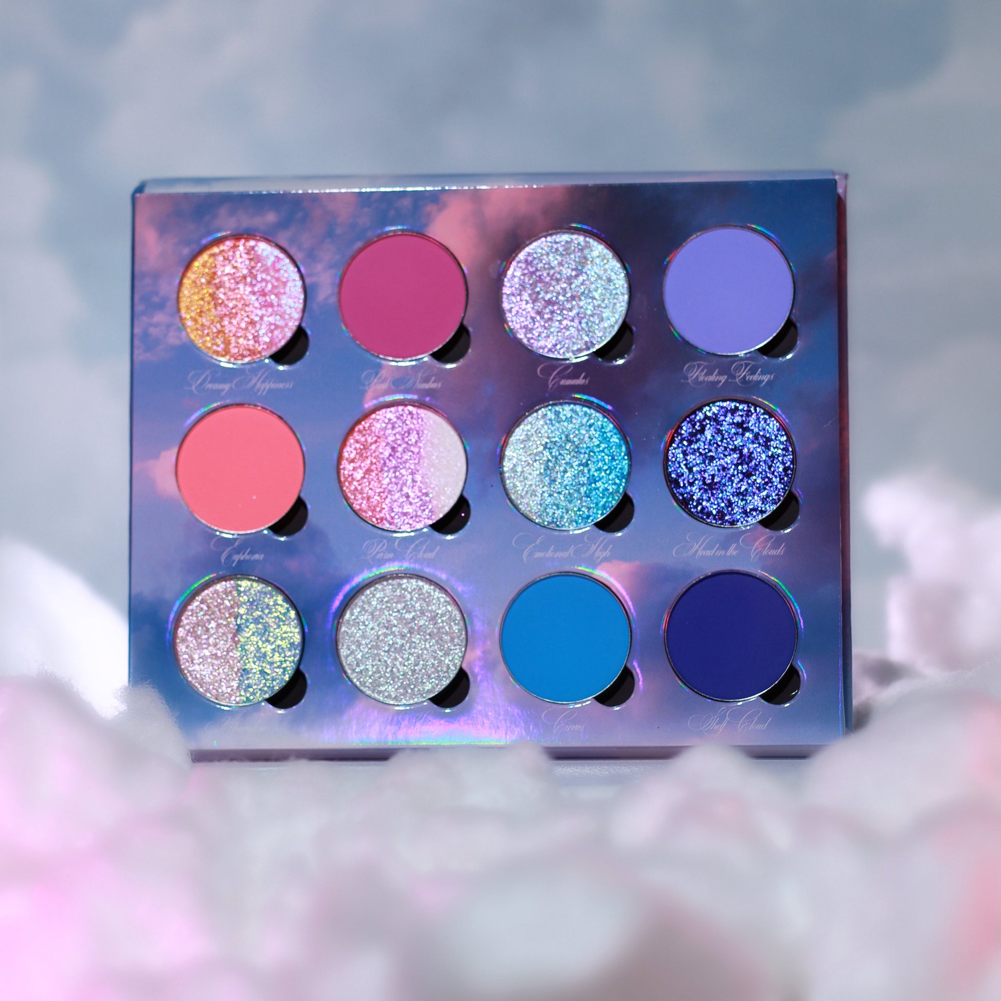 On Cloud 9 palette open top-down, 12 pans of coral, magenta, teal, silver, and blue shades