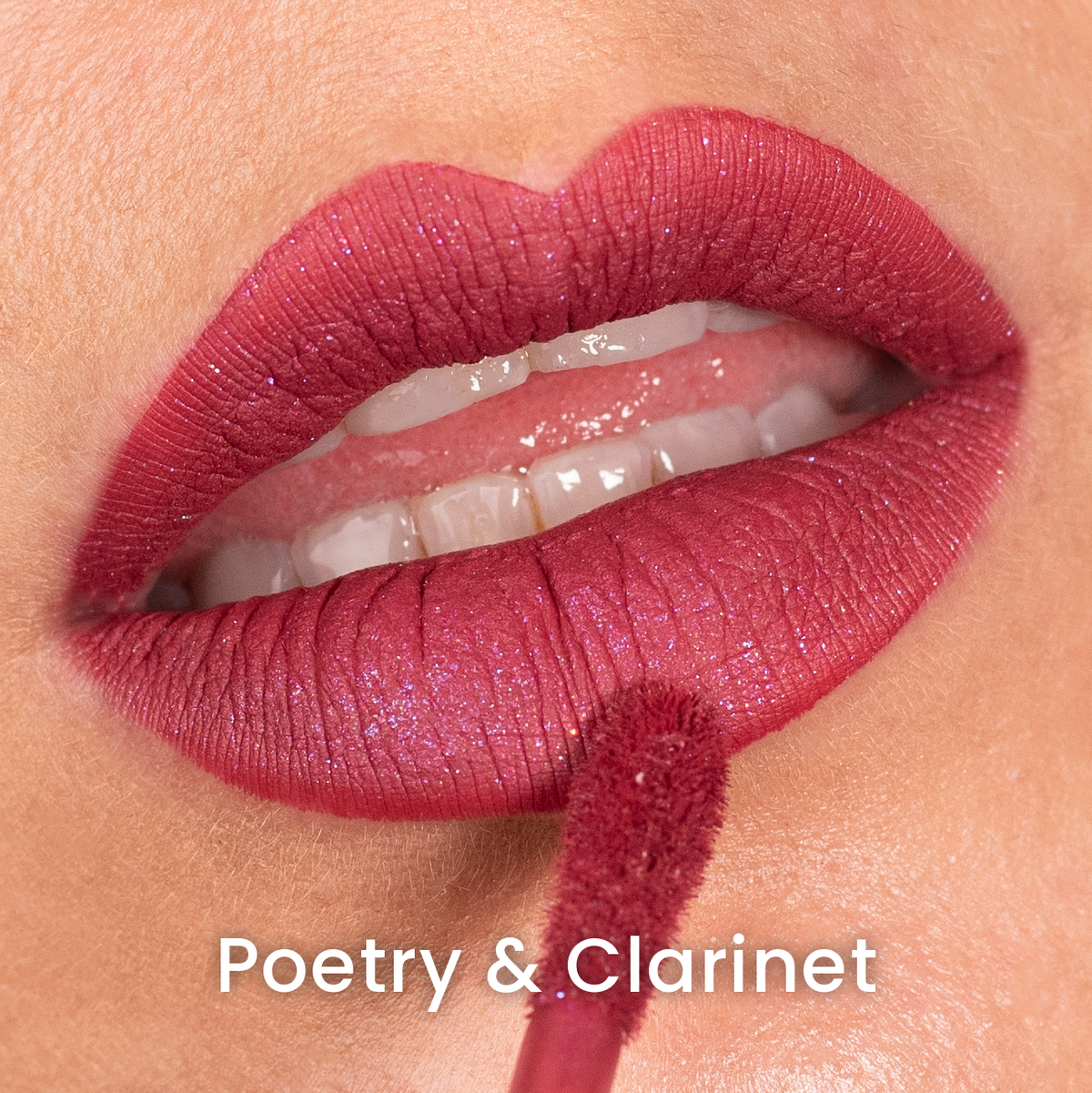 Poetry & Clarinet applied on light skin, terracotta red with a fine sparkle, labelled with the shade name