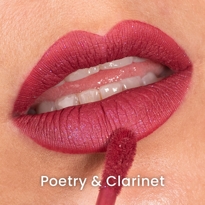 Poetry & Clarinet applied on light skin, terracotta red with a fine sparkle, labelled with the shade name