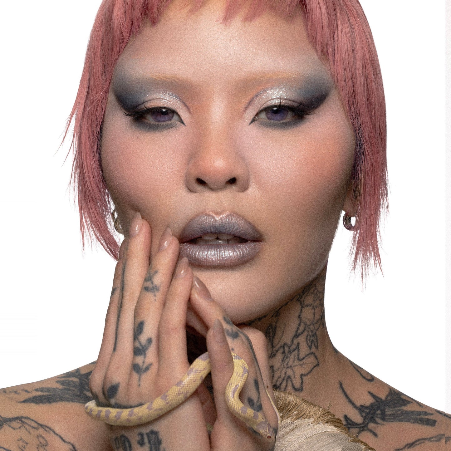 Model wearing a soft silver and grey eye look created with the Flora palette