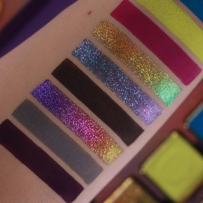 Close-up of Summerween sparkle swatches, a violet, a blue-green, and a gold colour-shifting stripe beside deep matte browns