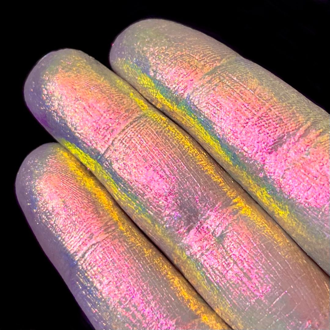 Blooming Charm swatch: navy shifts through pink to gold