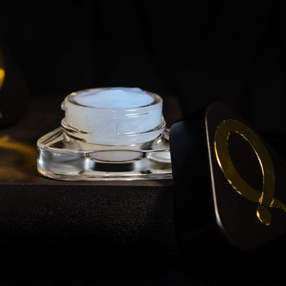 Question Beauty Gel Primer, open jar showing white gel formula with black lid and gold Q logo set against a dark background.