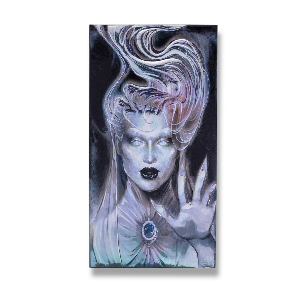 Closed The Final Offering lid, a ghostly figure with flowing white hair, black lips and a cameo brooch raising a clawed hand.