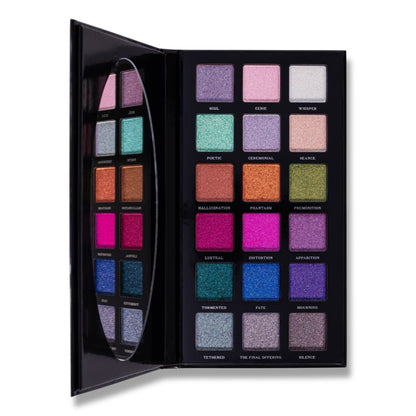The Final Offering palette open flat, 18 labelled shimmer pans in six rows of three, pastels at the top and jewel tones below, oval mirror on the lid.