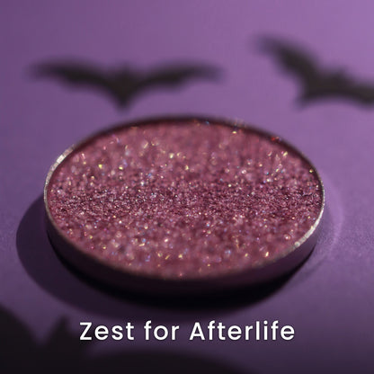 Zest for Afterlife pressed pigment pan, pink duochrome with fine rainbow sparkle