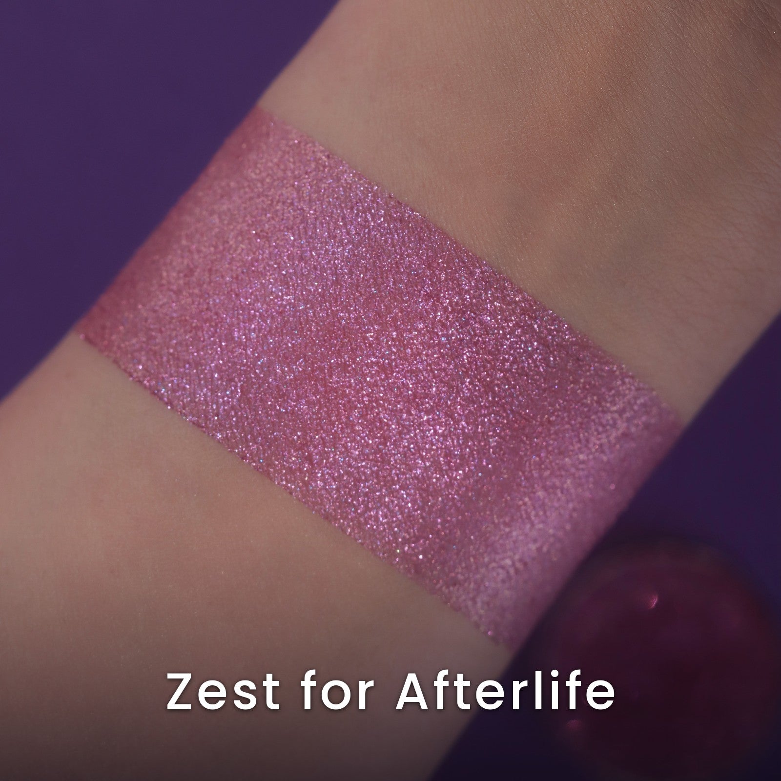 Zest for Afterlife swatch: sparkling pink-based duochrome cooling into lavender and icy blue with rainbow sparkle