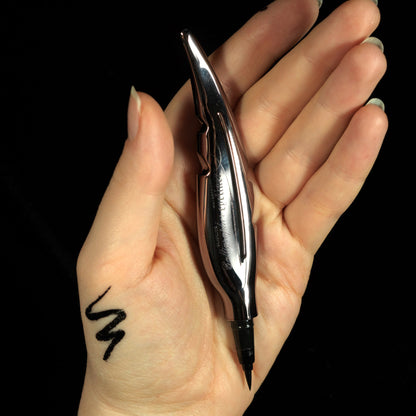 Calligrahper eyeliner by Glamlite Cosmetics on the palm of the hand