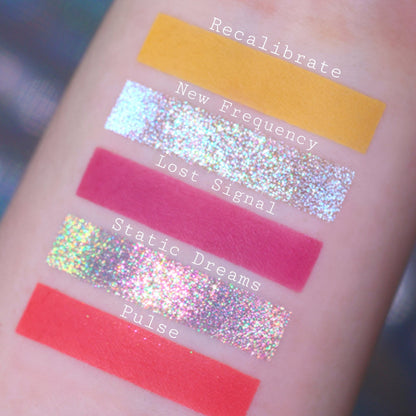 Swatches of Recalibrate, New Frequency, Lost Signal, Static Dreams, and Pulse, a marigold matte, holographic sparkles, and berry and coral mattes