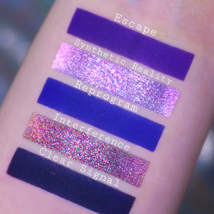 Swatches of Escape, Synthetic Reality, Reprogram, Interference, and Clear Signal, violet and cobalt mattes with pink and bronze multichrome sparkles