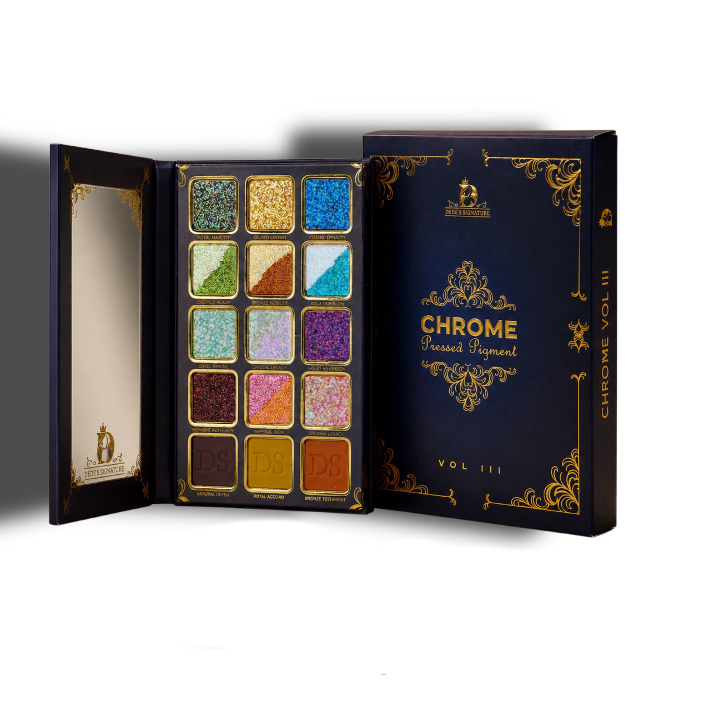 Dede's Signature Chrome Book volume III eyeshadow palette open, book-style navy packaging with gold filigree, 12 sparkle shades and 3 mattes across five rows.