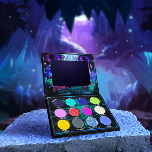 Fantasy Cosmetica Cosmic Cove eyeshadow palette open, twelve shades in a magical underwater cave scene with purple jellyfish and crystals