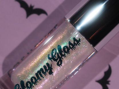Moonlit Magic tube on a lilac backdrop with paper bats, pink, gold and green iridescence in a clear base