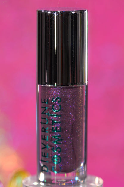 Purple Potion tube standing upright on a pink backdrop, logo side facing out