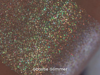 Ghostie Glimmer swatch macro on skin, multicoloured sparkle points