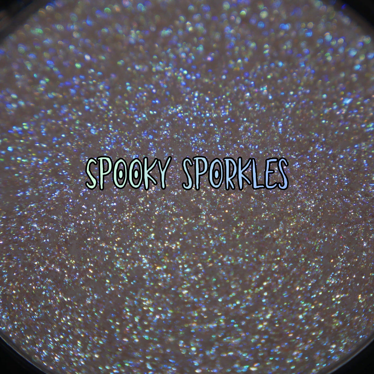Spooky Sporkle pan macro with the brand label, blue and green sparkle points