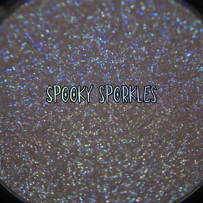 Spooky Sporkle pan macro with the brand label, blue and green sparkle points