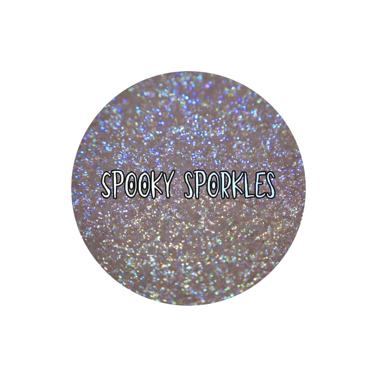 Spooky Sporkle round pan close-up labelled by the brand, blue and green sparkles on a transparent base