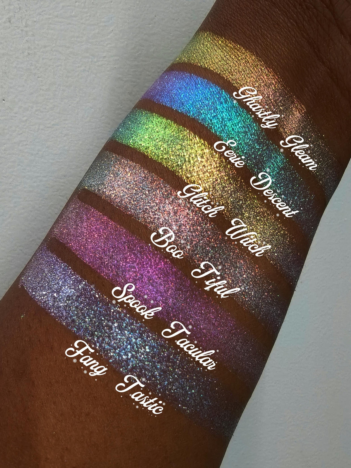 All six Sporkleween singles swatched on deep skin in a labelled diagonal, Ghastly Gleam at the top