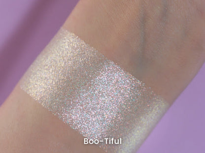 Boo-Tiful swatch on light skin against a lilac backdrop