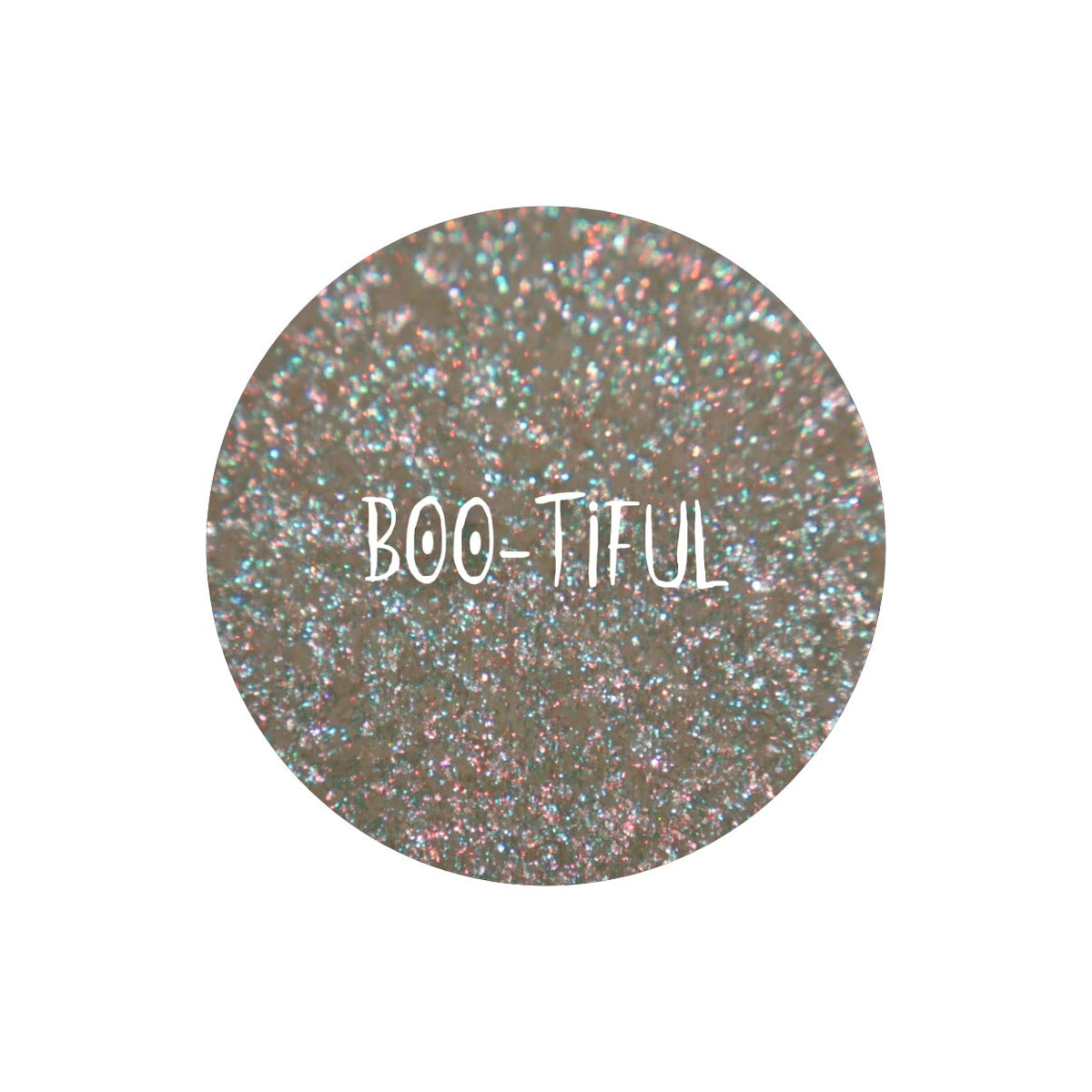 Boo-Tiful pan close-up, labelled: translucent base with a mint and gold shift and blue and orange sparkles