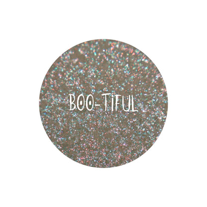 Boo-Tiful pan close-up, labelled: translucent base with a mint and gold shift and blue and orange sparkles