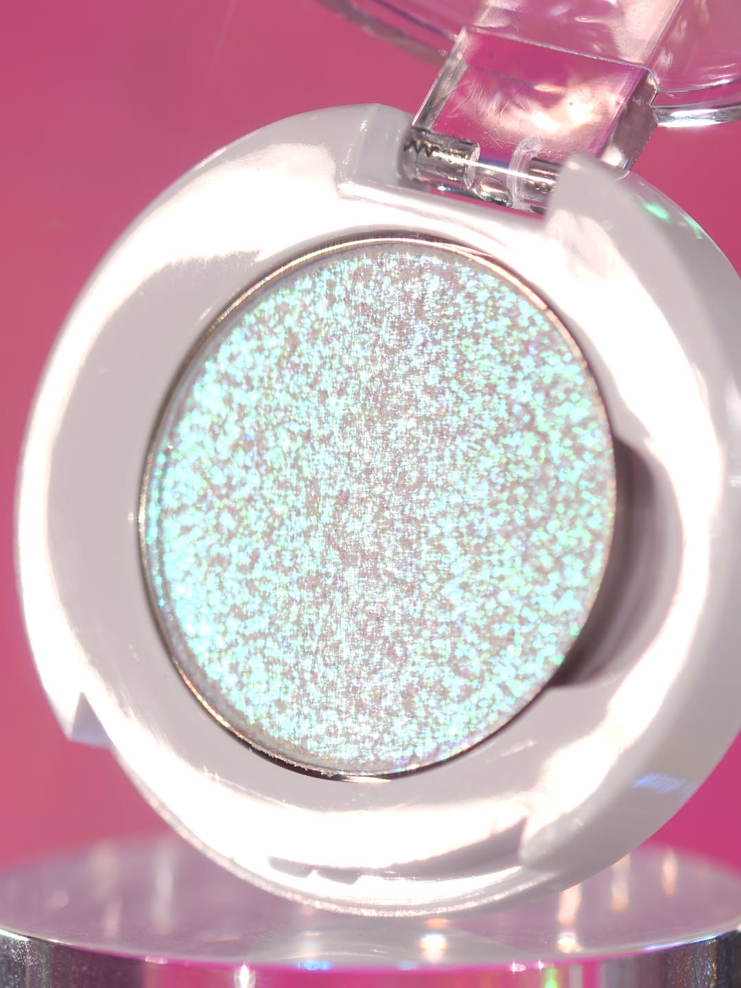 Eerie-Descent in its open compact on a pink backdrop