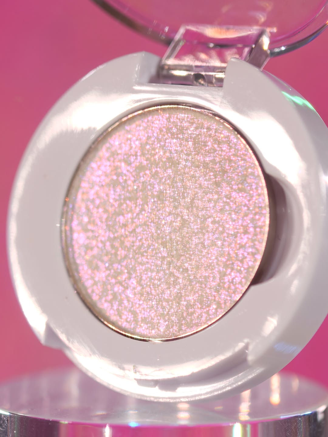Ghastly Gleam in its open compact on a pink backdrop