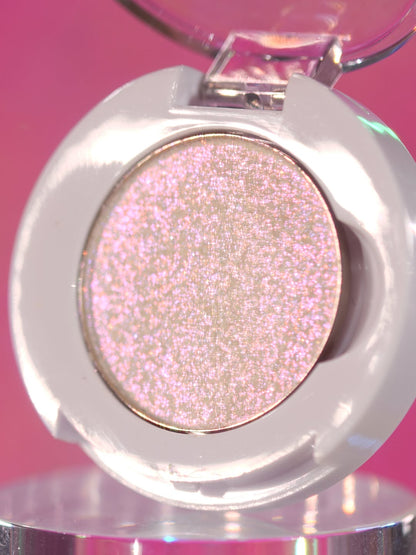 Ghastly Gleam in its open compact on a pink backdrop
